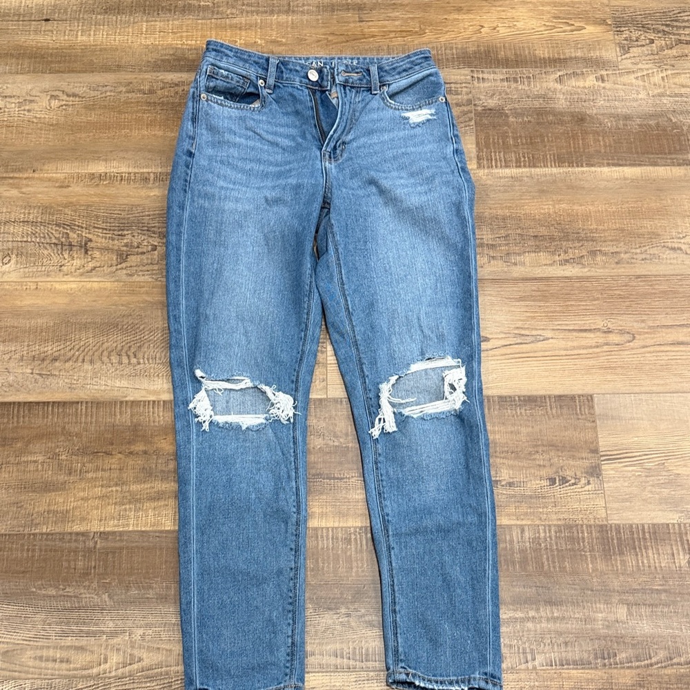Distressed Blue Women's Jeans - Classic High-Rise Fit American Eagle size 0